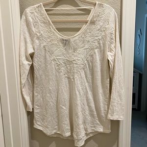 Cream long sleeved top.